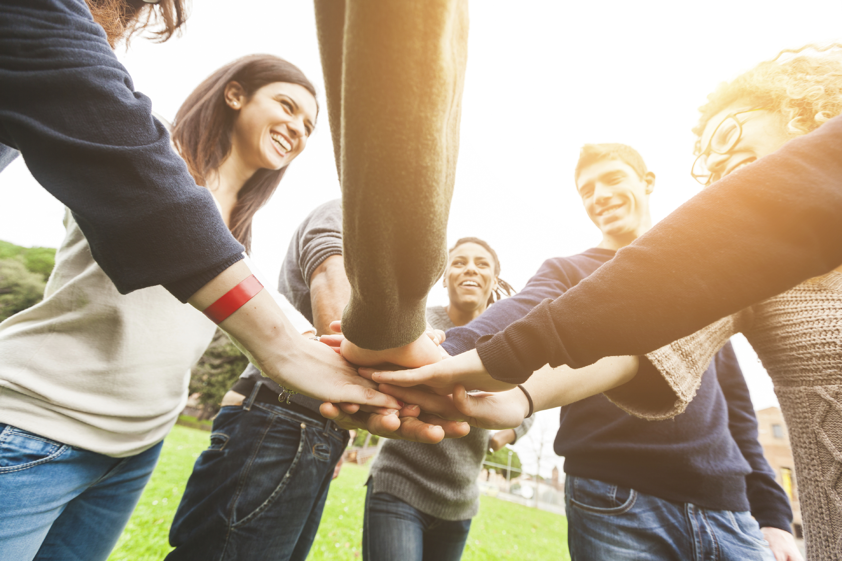 Multiracial Group of Friends with Hands in Stack, Teamwork